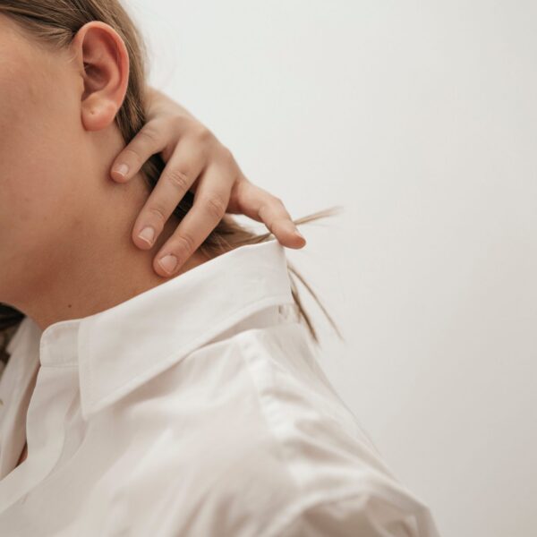 a person dealing with neck pain