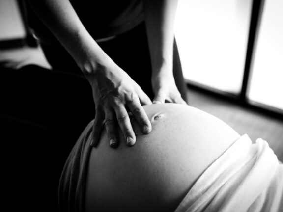 a picture of a pregnant women receiving webster technique